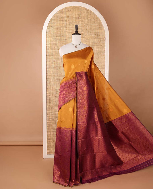 Borderless gold-purple zari buttas & half-&-half vanasingari-style flora-fauna woven kanchi silksaree,self-pallu & blue blouse of zari brocade