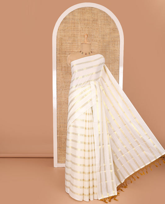 Borderless cream and mustard horizontal muthu zari striped Kerala cotton saree, self-pallu with tassels, and a matching blouse