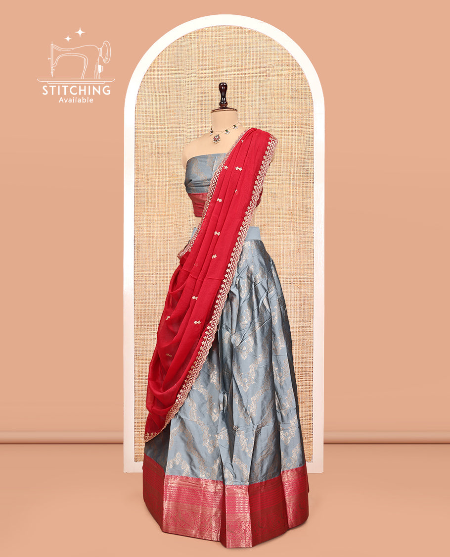 Grey Banarasi Half-Saree, Elevated with Floral Jacquard Design, a Contrast Traditional Zari Border, a Matching Blouse, and a Contrast Embroidered Dhavani