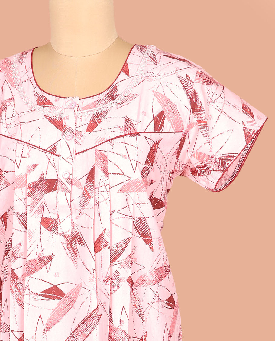Pale Pink Cotton Nighty Adorned with Geometric Patterns Print, Featuring Neck Lace Work, Round Front Neck, and Half-Sleeves