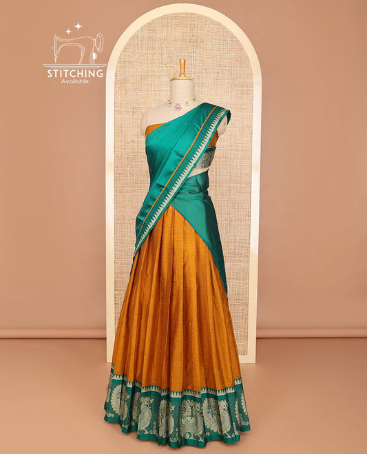 Mustard half saree with contrast peacock design border, embroidered blouse & plain, temple border dhavani