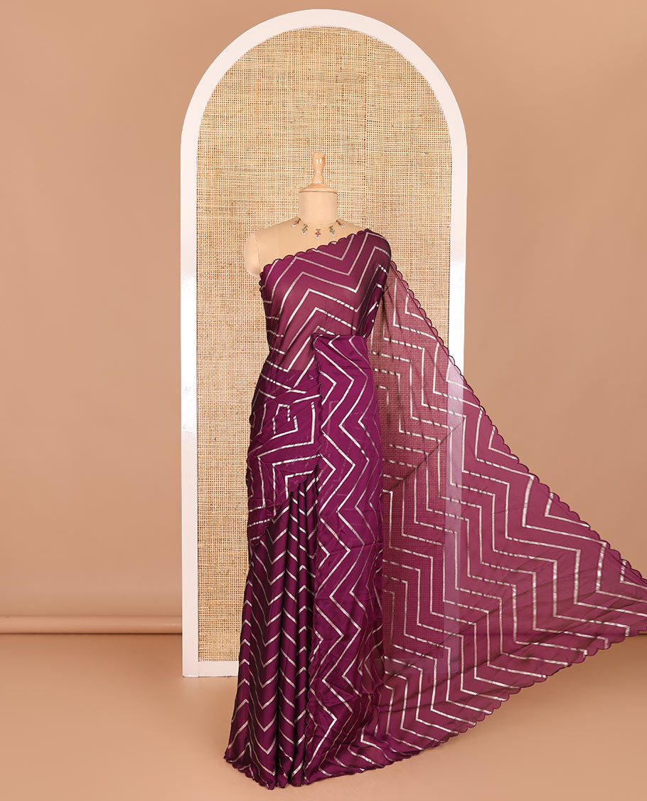 Borderless purple zig-zag stripes gold foil printed, scallop-edged rangoli chiffon saree with a matching bandhani dotted blouse