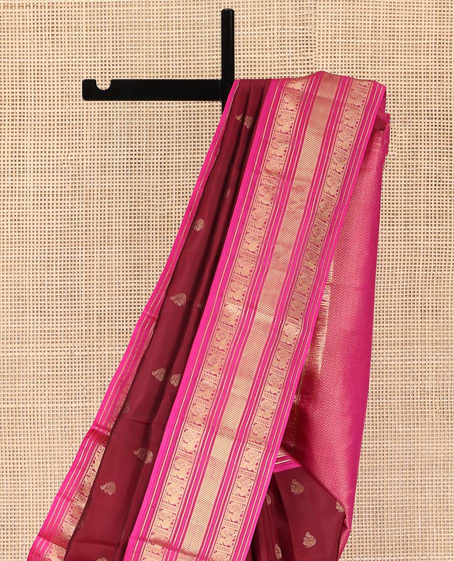 Red Kanchipuram Silk Saree, Opulently Embellished with Mayil Buttas on Its Body, Complemented by Contrast Border of Kathir, and Mayil Designs, Pallu Depicting Mayil Kann Designs, and Paired with a Contrast Blouse