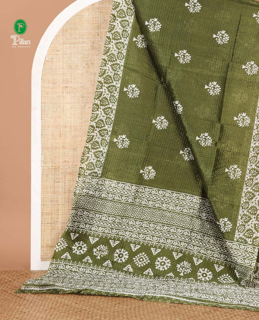 Olive green batik-style tree motif printed litch crushed saree, leaf print border, floral-geometric print pallu & floral print blouse