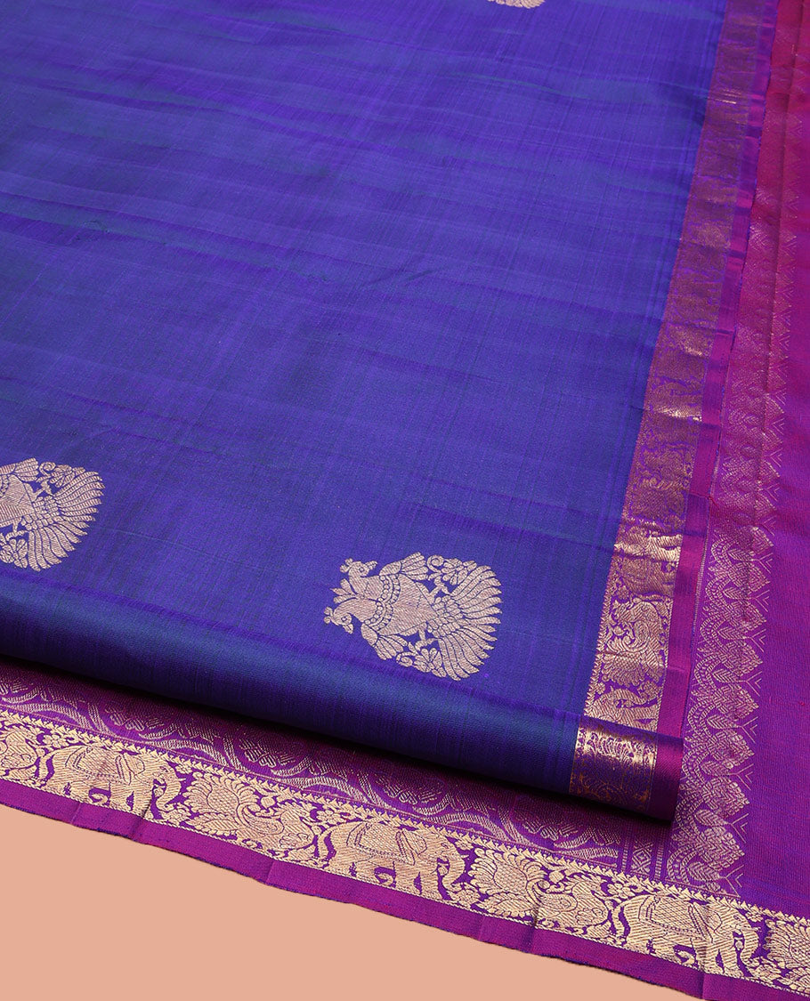 Blue Kanchipuram Silk Saree, Enthralled with Iruthalai Pakshi Buttas All Over Its Body, Complemented by Contrast Border of Rekku, Mayil, and Yaanai Designs, Pallu of Floral Jaal Designs, and Paired with a Contrast Blouse