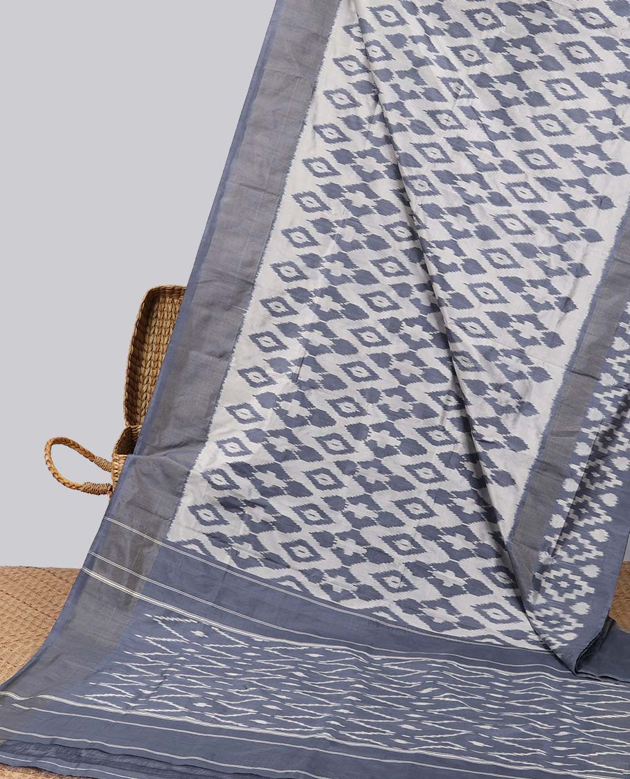 Grey ogee design ikkat silk saree with contrat plain border & argyle design pallu