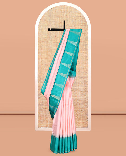 Peach Kanchipuram Silk Saree, Sparsely Woven with Buttas, Complemented by a Contrast Thazampoo Rekku Border, Chevron Striped Pallu, and a Contrast Blouse