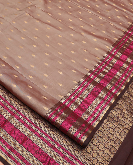 Grey Vasundhara Lite Silk Mix Saree, Subtly Woven with Zari Buttas All Over Its Body, Complemented by Contrast Border of Kodi Visiry Designs, Pallu Steeped with Chakram Designs, and Paired with a Contrast Blouse