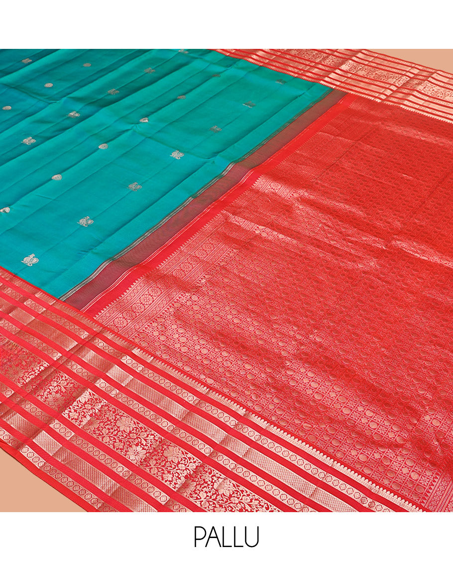 Rama Vasundhara Silk Saree, Accentuated with Zari Buttas All Over Its Body, Complemented by a Contrast Varisai Pettu Border of Thilakam, Neli, Laddu Kamalam, and Kodi Visiry Designs, Grand Pallu of Butta Enclosed Checks, and Paired with a Contrast Blouse