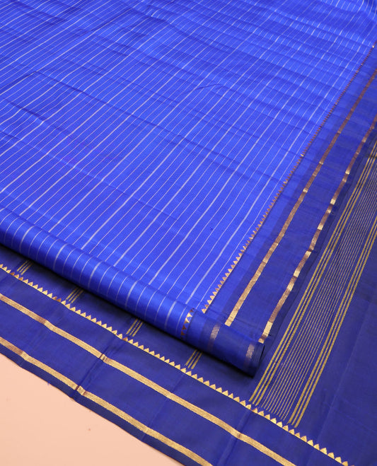 Blue Kanchipuram Silk Saree, Elevated with Stripes All Over Its Body, Complemented by Contrast Temple Zari Border, Subtly Zari-Striped Pallu, and Paired with a Contrast Blouse