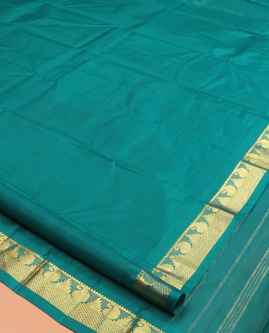 Green Kanchipuram Silk Saree, Woven with Zari Buttas, Highlighted by Zari Border of Rekku, Muthu, Manga, and Mayil Kann Designs, Pallu of Zari Design, and a Matching Blouse