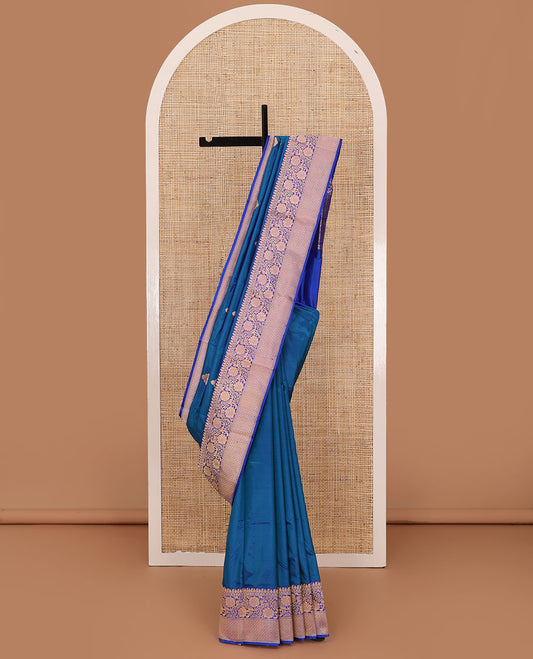 Blue thilakam motifs katan silk saree, traditional border of floral creeper design, and jaal pallu