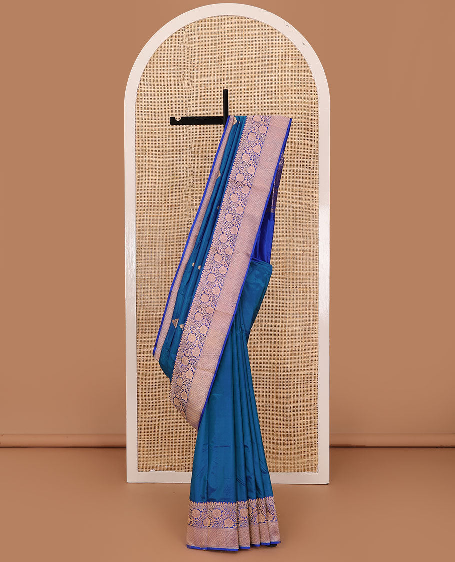 Blue thilakam motifs katan silk saree, traditional border of floral creeper design, and jaal pallu