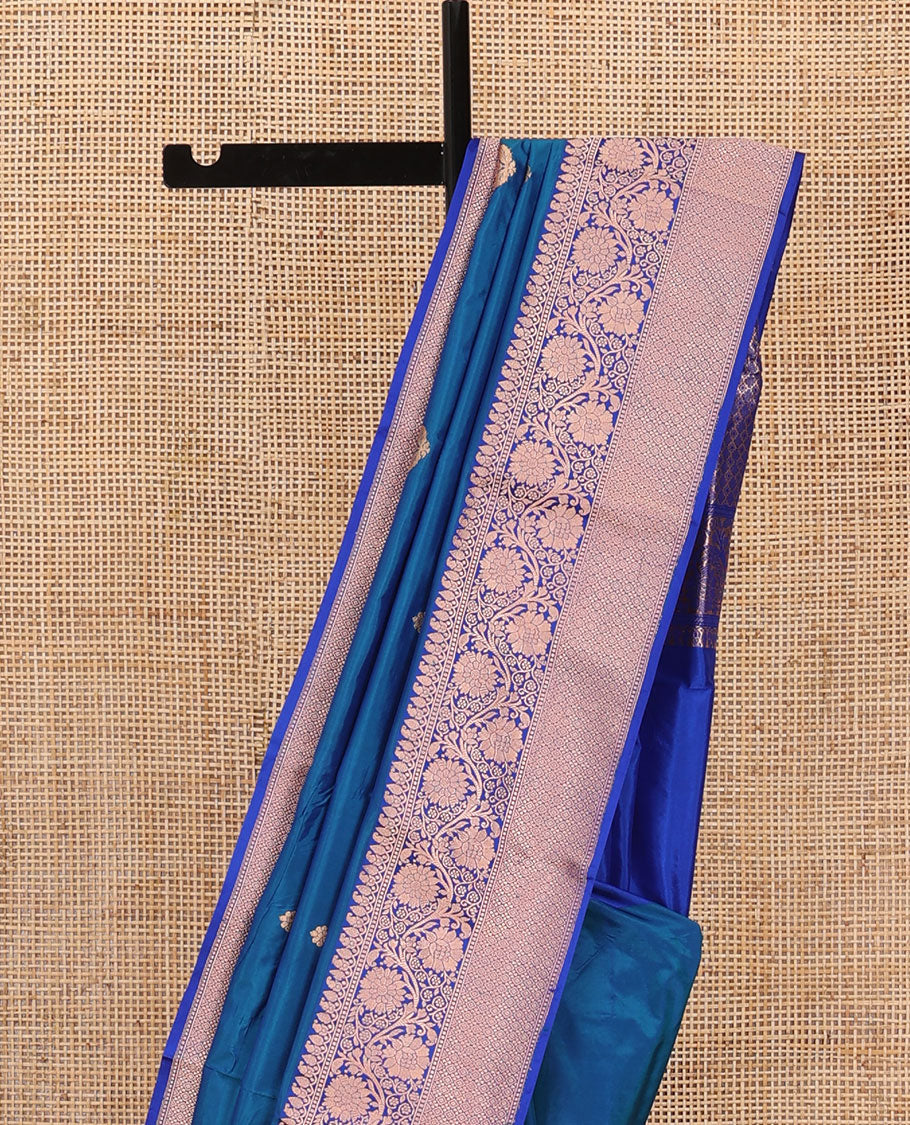 Blue thilakam motifs katan silk saree, traditional border of floral creeper design, and jaal pallu