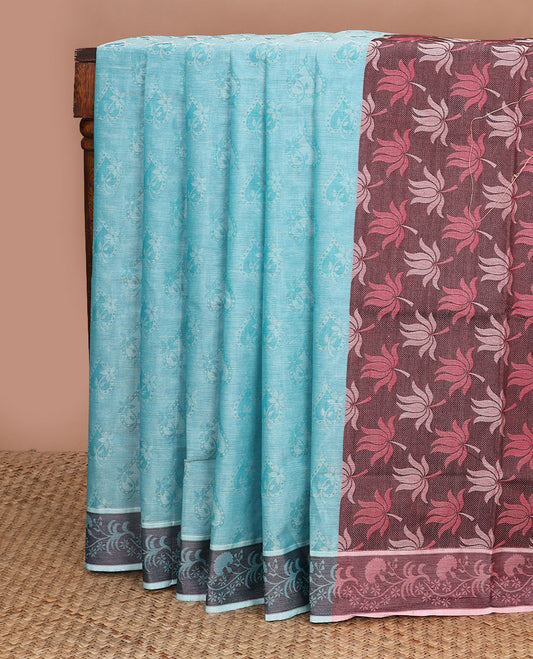 Blue spade-patterned Coimbatore cotton saree, floral creeper border, & contrast lotus motifs pallu