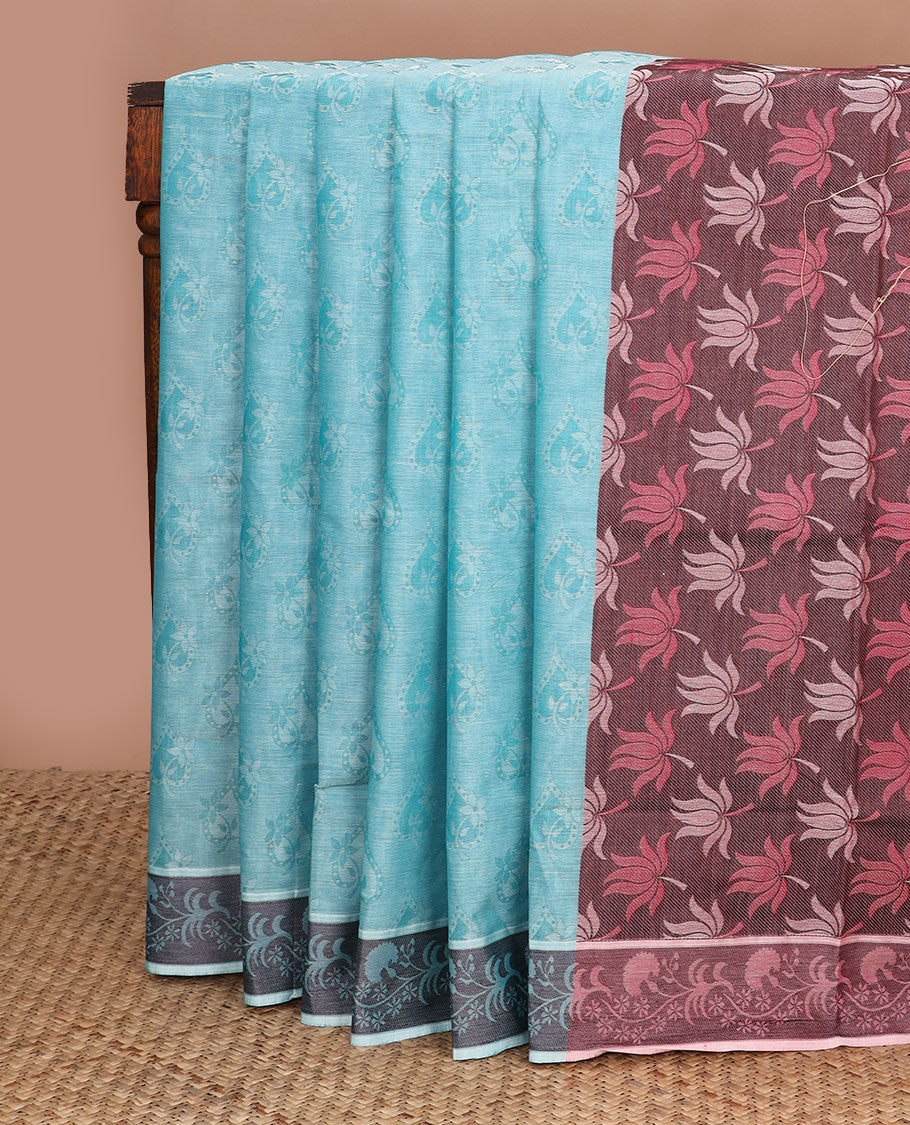 Blue spade-patterned Coimbatore cotton saree, floral creeper border, & contrast lotus motifs pallu