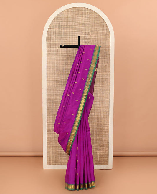 Rani Pink Kanchipuram Silk Saree, Decorated with Zari Buttas All Over Its Body, Complemented by Contrast One-Sided Border of Banaras and Jaal Designs, Pallu Features Zari Designs, and Comes Without a Blouse