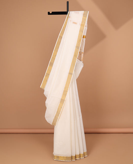 Cream kerala saree, zari border & pallu of peacock zari designs