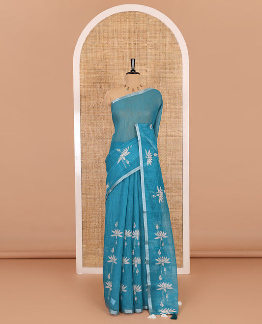 Peacock Pichwai lotus printed linen cotton saree, piping zari border, colorful tasselled lotus printed pallu, and a contrast lotus printed blouse