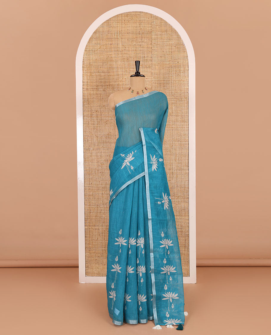 Peacock Pichwai lotus printed linen cotton saree, piping zari border, colorful tasselled lotus printed pallu, and a contrast lotus printed blouse