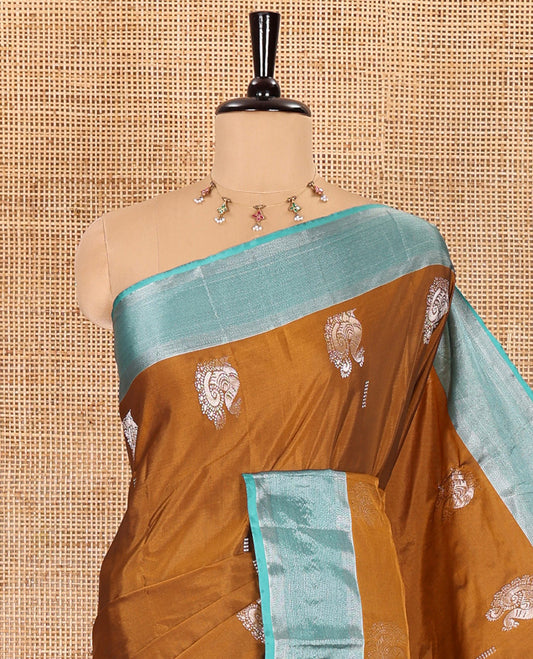 Gold dobby and peacock buttas semi-soft silk saree, contrast zari striped border, zari buttas pallu, and a matching blouse