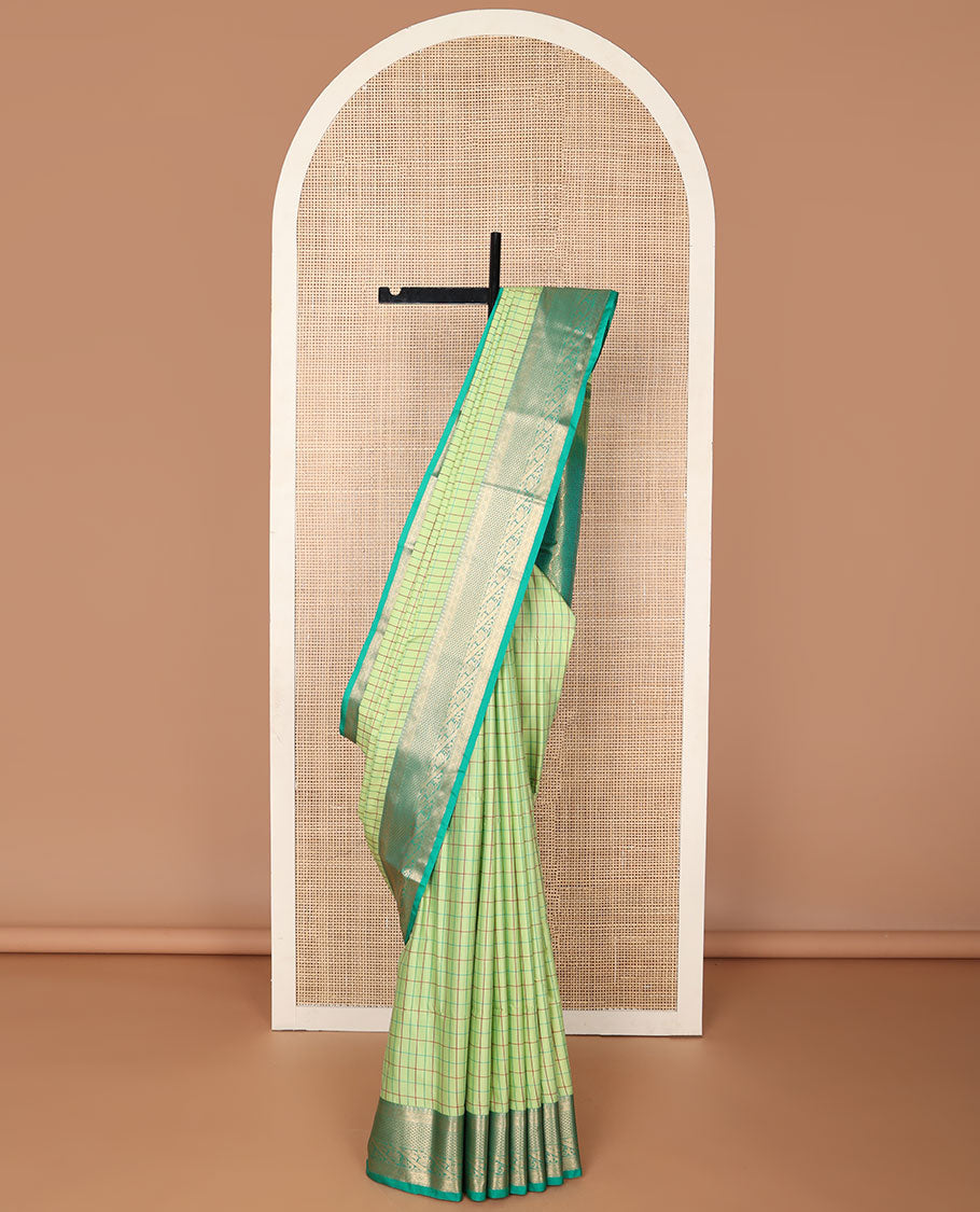 Light green checked soft silk saree with contrast zari design border & floral design pallu
