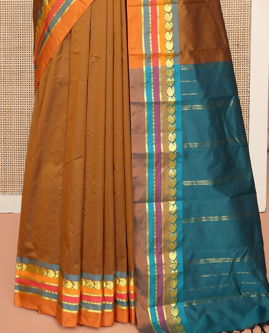 Brown Plain Aarani Silk Saree, Complemented by a Contrast Traditional Zari Design Border, Zari Striped Pallu, and Paired with a Contrast Blouse