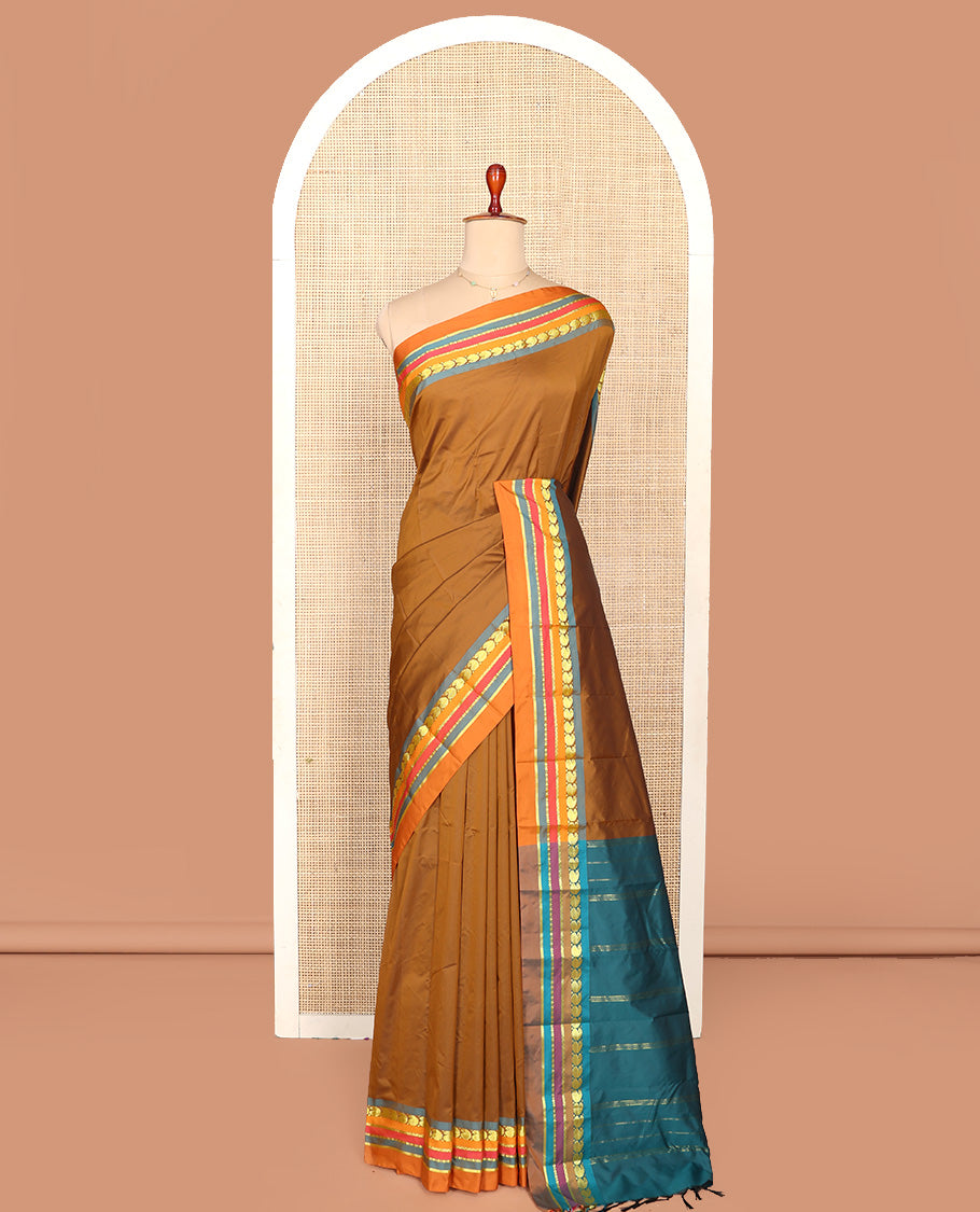Brown Plain Aarani Silk Saree, Complemented by a Contrast Traditional Zari Design Border, Zari Striped Pallu, and Paired with a Contrast Blouse
