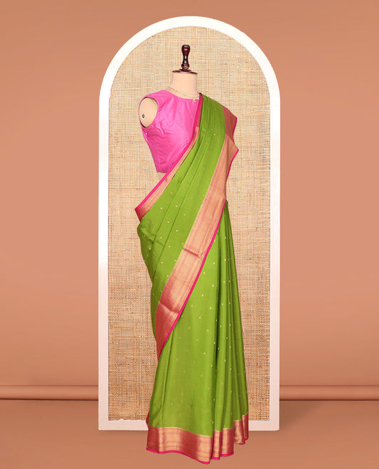 Green Mysore Silk Saree, Detailed with Zari Buttas All Over Its Body, Complemented by a Contrast Zari Border of Traditional Designs, Grandly Zari Decked Up Pallu of Jaal Designs, and Paired with a Contrast Blouse