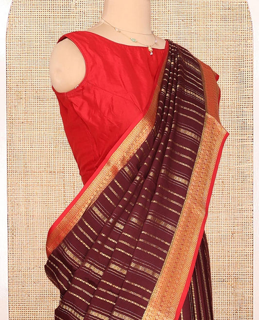 Brown Mysore Silk Saree, Spotlighted By Geometric Zari Designs All Over Its Body, Complemented by Captivating Contrast Border of Traditional Zari Designs, Gleaming Zari Striped Pallu, and Paired with a Contrast Blouse