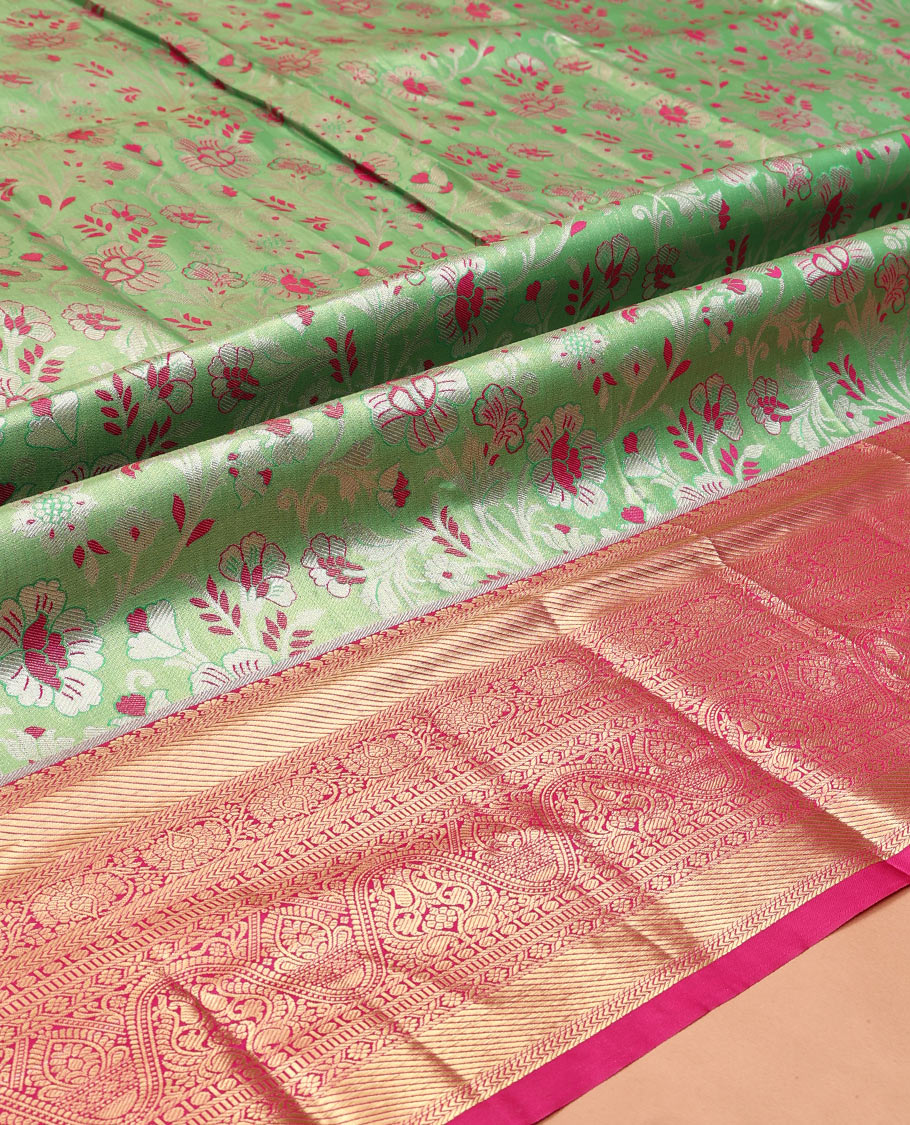 Green Art Silk Material Half Saree, Spotlighted with Jacquard Skirt, a Contrast Traditional Zari Border, Contrast Blouse, and an Intricate Dhavani