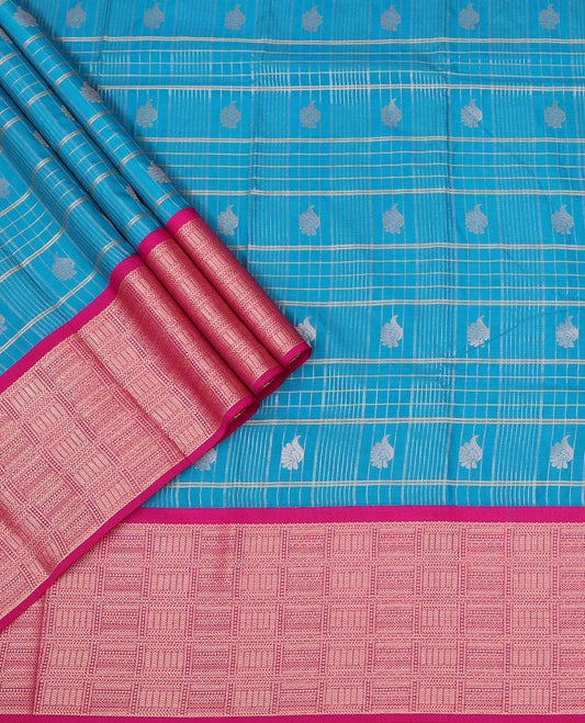Blue Art Silk Pavadai Material Set Featuring a Zari Butta Enclosed Checked Skirt, Complemented by a Contrast Checked Zari Woven Border, and Paired with a Contrast Blouse