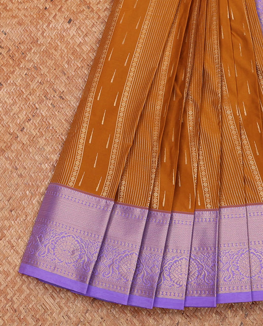 Mustard geometric patterned budget silk saree, contrast traditional zari border, and pallu of intricate designs