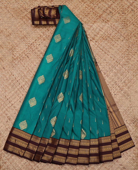 Green Budget Silk Saree, Gleamed Up with Zari Buttas All Over Its Body, Complemented by a Contrast Traditional Zari Design Varisai Pettu Border, Grand Jaal Pallu, and Paired with a Contrast Blouse