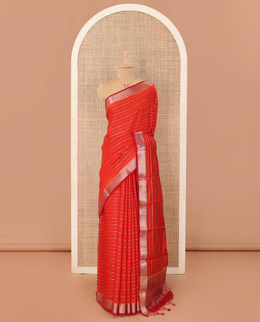Red horizontal striped Assam silk saree, traditional zari border, and zari-rich gleaming pallu