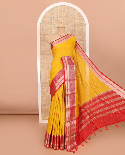 Yellow Assam Silk Saree Adorned with All-Over Buttas, Featuring a Contrast Temple Border of Butta Enclosed Checked Design, a Pallu Steeped with Zari Stripes, and Paired with a Contrast Zari Design Blouse