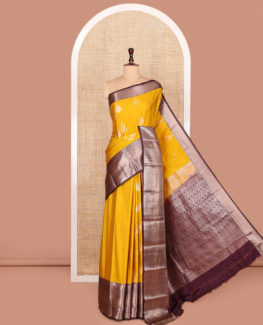 Yellow Budget Silk Saree, Ornamented with Zari Buttas All Over Its Body, Complemented by Contrast Border of Traditional Designs Woven in Zari, Gracefully Embellished Pallu, and Paired with a Contrast Blouse