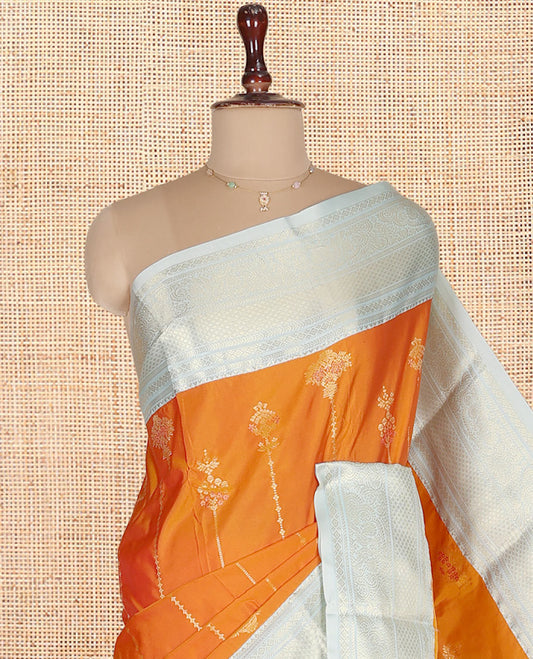 Orange Budget Silk Saree, Steeped in Richness of Zari Buttas on Its Body, Complemented by a Contrast Traditional Zari Design Border, Intricately Designed Pallu, and Paired with a Contrast Blouse