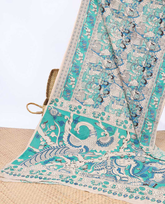 Blue human motifs machine-printed kalamkari cotton saree, Pichwai cow border & animal motifs pallu