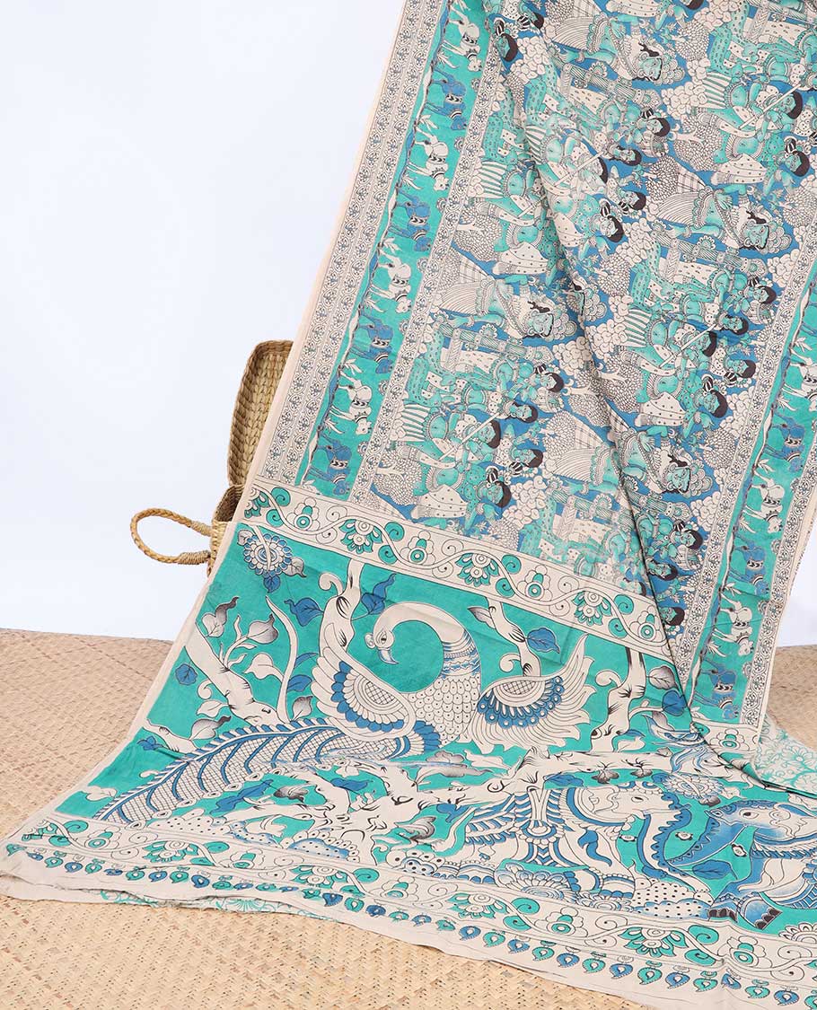 Blue human motifs machine-printed kalamkari cotton saree, Pichwai cow border & animal motifs pallu