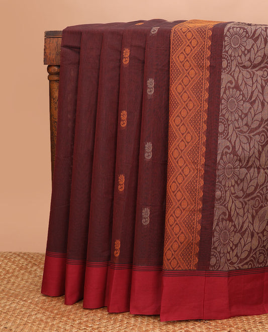 Brown buttas Kanchi cotton saree, contrast plain border, and pallu of floral and paisleys