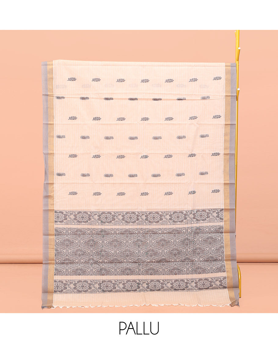 Cream Kanchi Cotton Saree, Bedecked with Buttas and Stripes All Over Its Body, Complemented by Contrast Border, Ogee Patterned Pallu, and Paired with a Matching Blouse