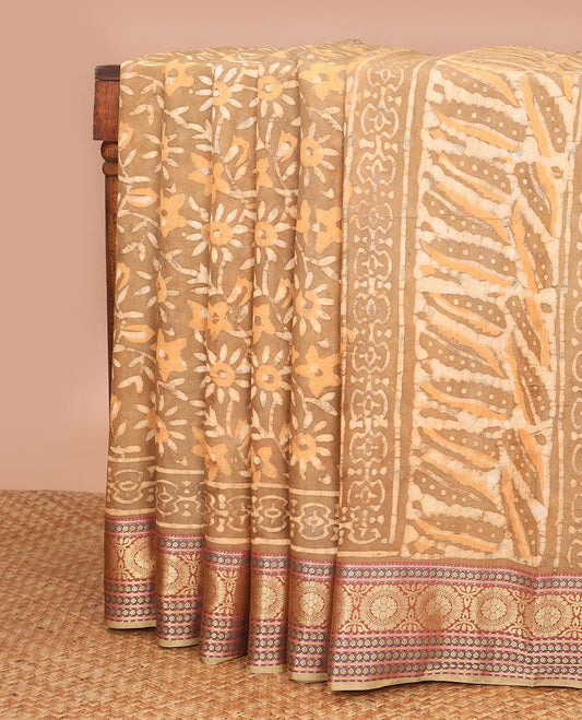 Brown floral batik print chanderi cotton saree with contrast intricate zari design border & striped pallu