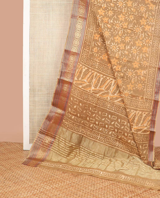 Brown floral batik print chanderi cotton saree with contrast intricate zari design border & striped pallu