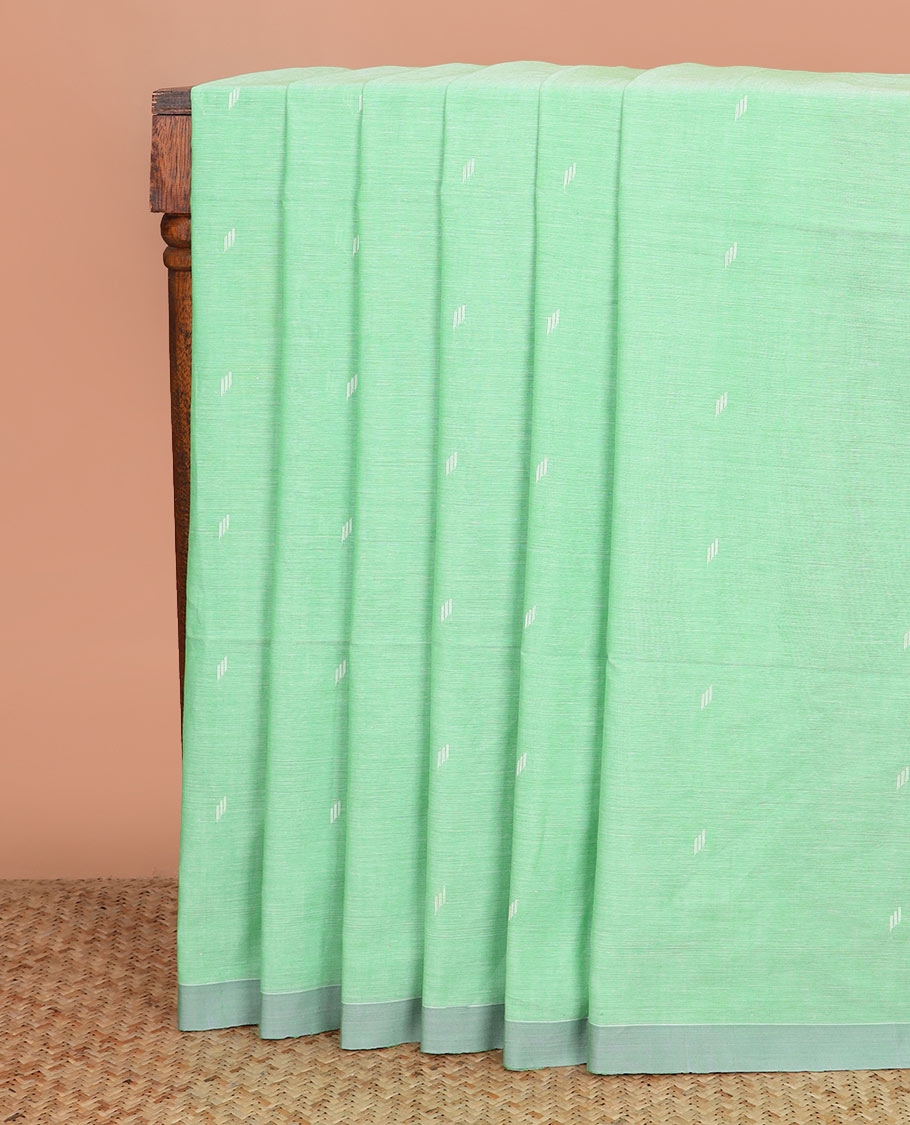 Pista green thread buttas Khadi cotton saree, contrast plain border, and pallu of geometric buttas