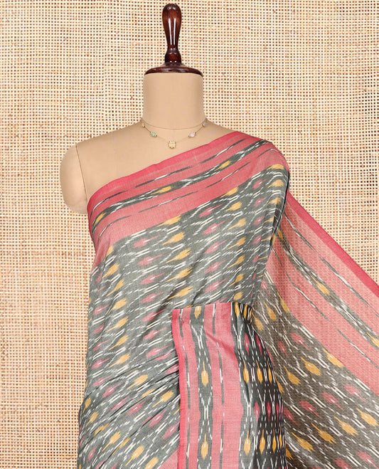 Grey Ikkat Cotton Saree, Enriched with Ikkat-Style Ogee Patterns All Over Its Body, Complemented by a Contrast Ikkat-Style Border, Pallu of Chevron Patterns, and Has No Blouse