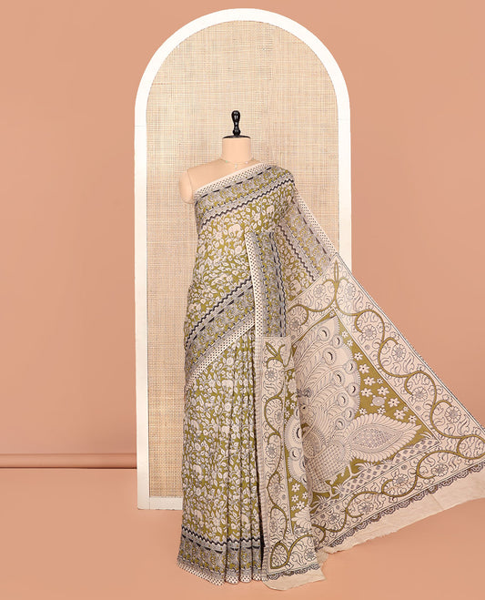 Green Kalamkari Cotton Saree, Bedecked with Flora-Fauna Print, Elephant Motifs Border, Pallu of Peacock Motifs, and a Matching Blouse