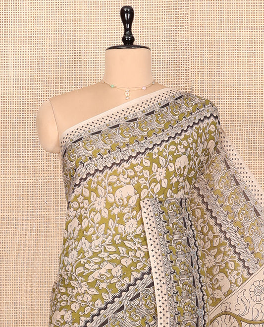 Green Kalamkari Cotton Saree, Bedecked with Flora-Fauna Print, Elephant Motifs Border, Pallu of Peacock Motifs, and a Matching Blouse