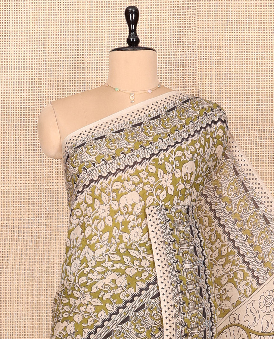 Green Kalamkari Cotton Saree, Bedecked with Flora-Fauna Print, Elephant Motifs Border, Pallu of Peacock Motifs, and a Matching Blouse