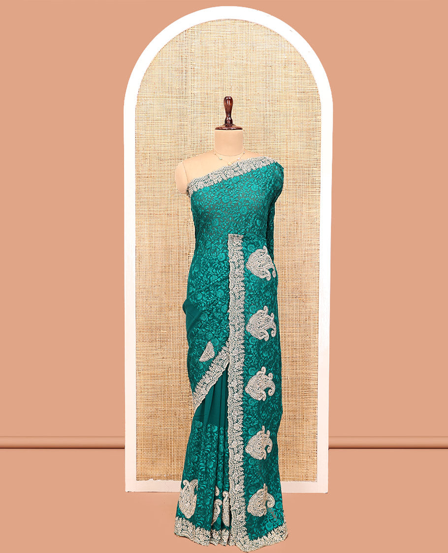Green Designer Saree, Spotlighted with Floral Vine Embroidery, a Scallop Embroidered Border, and a Matching Blouse